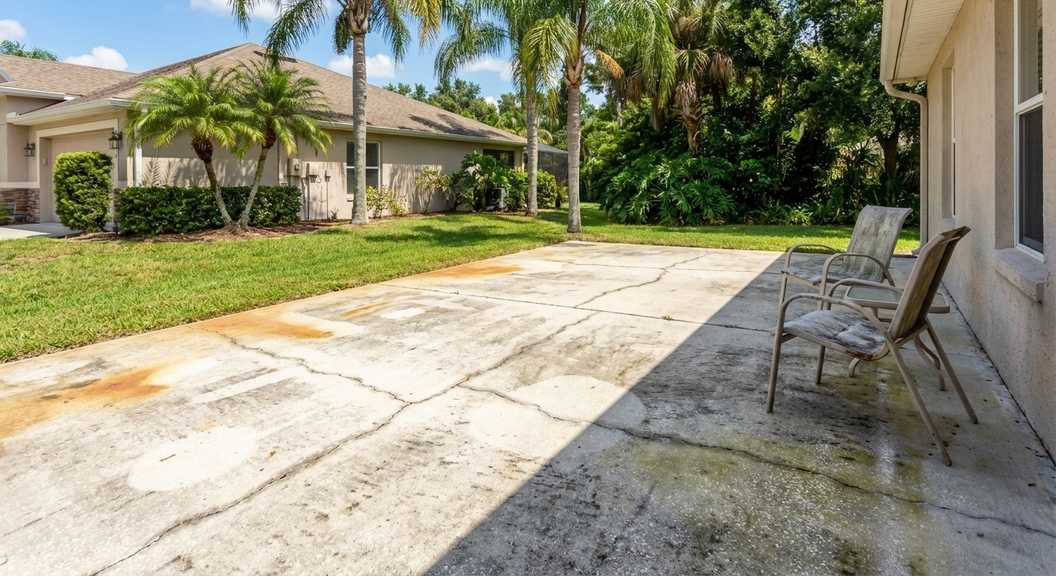 Faded concrete patio in Orlando negatively affecting home's curb appeal